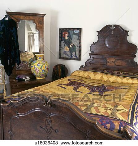 Oriental style gold silk hand-painted cover on antique bed in bedroom with large yellow ceramic pot on table in front of mirror View Large Photo Image Stock Photo - Oriental style gold silk hand-painted cover on antique bed in bedroom with large yellow ceramic pot on table in front of mirror. Fotosearch