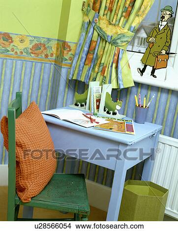Picture - Painted blue table in a child's blue and green bedroom. Fotosearch