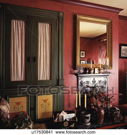 Painted green dresser in traditional red living room View Large Photo Image Stock Image - Painted green dresser in traditional red living room. Fotosearch