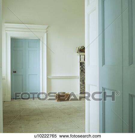 Pastel blue doors and stone flooring in white Georgian hall View Large Photo Image Stock Photography - Pastel blue doors and stone flooring in white Georgian hall. Fotosearch