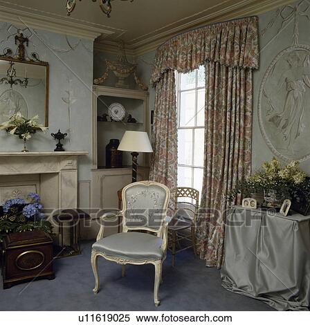 Patterned curtains in traditional living room with trompe l'oiel murals View Large Photo Image Stock Photography - Patterned curtains in traditional living room with trompe l'oiel murals. Fotosearch