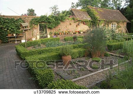 Paved path in walled garden with low box hedging View Large Photo Image Stock Photography - Paved path in walled garden with low box hedging. Fotosearch