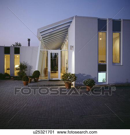 Paving in front of Modern white house in the country lit at night View Large Photo Image Stock Image - Paving in front of Modern white house in the country lit at night. Fotosearch
