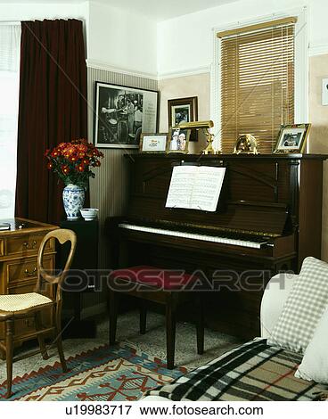 Piano in corner of small living room View Large Photo Image Stock Photo - Piano in corner of small living room. Fotosearch