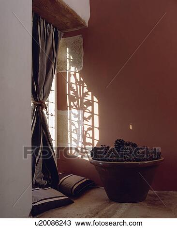 Pinecones in large earthenware bowl in front of window with striped curtain View Large Photo Image Stock Image - Pinecones in large earthenware bowl in front of window with striped curtain. Fotosearch