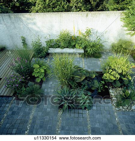 Pond and paving in town garden View Large Photo Image Picture - Pond and paving in town garden. Fotosearch