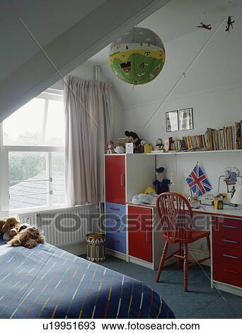 Red and blue storage units and integral desk in child's bedroom  View Large Photo Image Stock Image - Red and blue storage units and integral desk in child's bedroom . Fotosearch