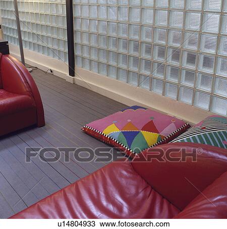 Red leather sofa in modern living room with glass brick wall View Large Photo Image Stock Image - Red leather sofa in modern living room with glass brick wall. Fotosearch