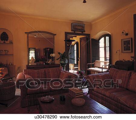 Red sofas in traditional Spanish living room View Large Photo Image Stock Image - Red sofas in traditional Spanish living room. Fotosearch
