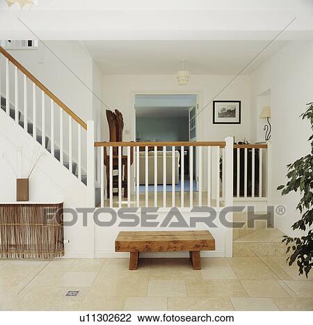 Rustic wooden table in modern white hall with limestone floor tiles View Large Photo Image Stock Image - Rustic wooden table in modern white hall with limestone floor tiles. Fotosearch