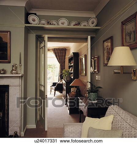 Shelf above door in traditional living room View Large Photo Image Stock Image - Shelf above door in traditional living room. Fotosearch