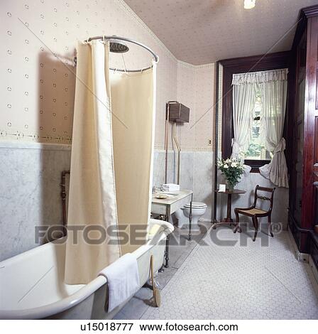 Picture Of Shower Curtain On Circular Frame Above Rolltop Bath In Picture Shower Curtain On Circular Frame Above Rolltop Bath In Bathroom With Marble Wall To