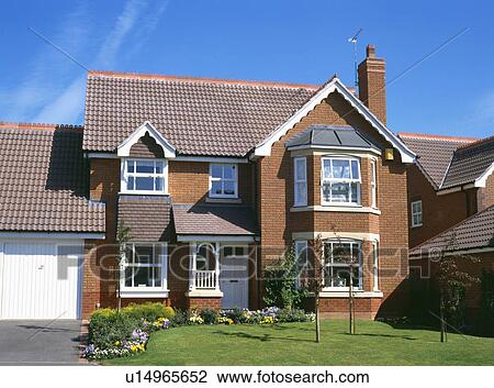 Small lawn in front of traditional detached newbuild house with garage View Large Photo Image Stock Image - Small lawn in front of traditional detached newbuild house with garage. Fotosearch