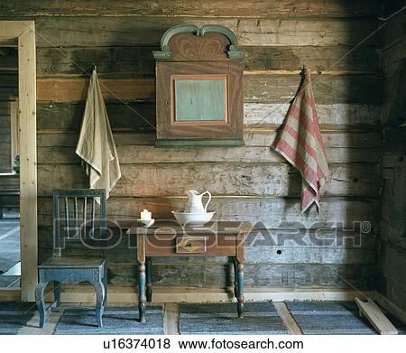 Small painted wooden cupboard on horizontal panelled wooden wall in small chalet hall with painted wood chair View Large Photo Image Stock Photo - Small painted wooden cupboard on horizontal panelled wooden wall in small chalet hall with painted wood chair. Fotosearch
