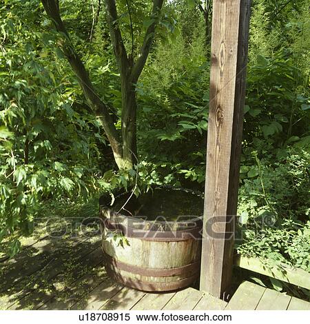 Small water feature in wooden barrel View Large Photo Image Stock Photography - Small water feature in wooden barrel. Fotosearch