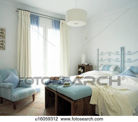 Stock Image - Spanish Styled Bedroom in the Morning.. Fotosearch