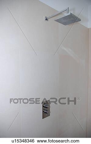 Square chrome shower head in modern white shower room View Large Photo Image Stock Photograph - Square chrome shower head in modern white shower room. Fotosearch