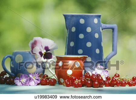 Stock Photo - Still-life of blue and red spotted jugs. Fotosearch