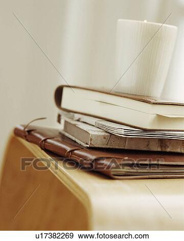 Still-Life of leather-bound notebooks and ceramic cup View Large Photo Image Stock Photo - Still-Life of leather-bound notebooks and ceramic cup. Fotosearch
