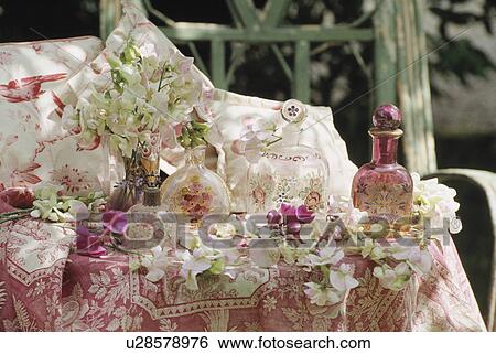 Still-life of painted glass bottles and sweetpeas View Large Photo Image Stock Photograph - Still-life of painted glass bottles and sweetpeas. Fotosearch