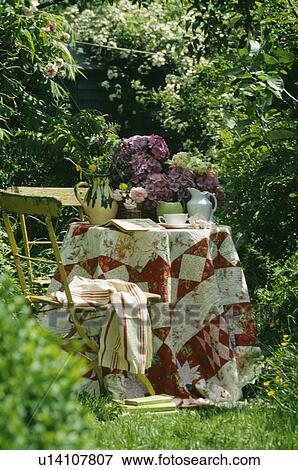 Still-Life of patchwork cloth on garden table View Large Photo Image Stock Photo - Still-Life of patchwork cloth on garden table. Fotosearch