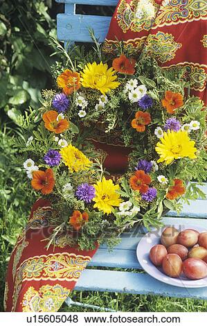 Stock Photo - Still-Life of summer flowers in fresh floral wreath. Fotosearch