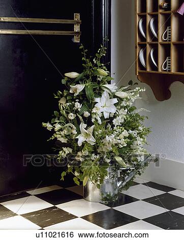Still-Life of white flowers in watering can View Large Photo Image Stock Photograph - Still-Life of white flowers in watering can. Fotosearch