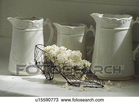 Still-Life of white jugs and metal shoe View Large Photo Image Stock Image - Still-Life of white jugs and metal shoe. Fotosearch