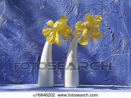 Stock Image - Still-Life of yellow tulips in white vases. Fotosearch