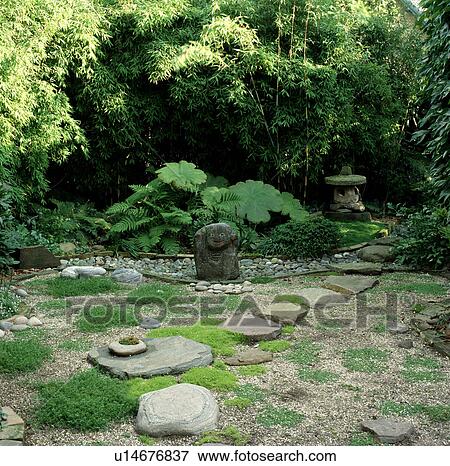 Stone sculpture in green Japanese-style garden View Large Photo Image Stock Photo - Stone sculpture in green Japanese-style garden. Fotosearch