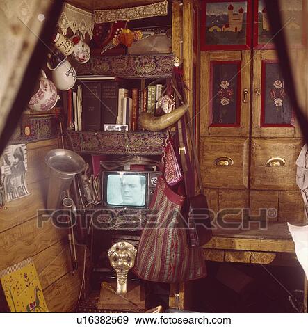 Television and painted fitted cupboard in cabin of traditional narrow boat View Large Photo Image Stock Photo - Television and painted fitted cupboard in cabin of traditional narrow boat. Fotosearch