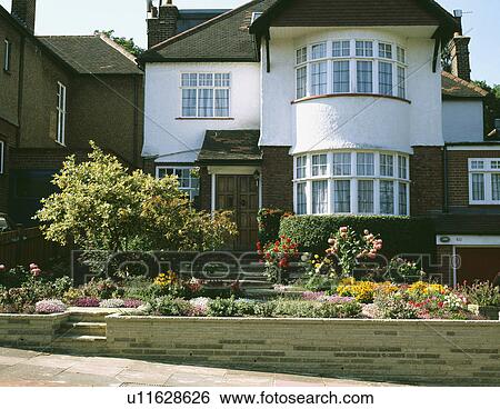Thirties detached house with small front garden View Large Photo Image Stock Photograph - Thirties detached house with small front garden. Fotosearch