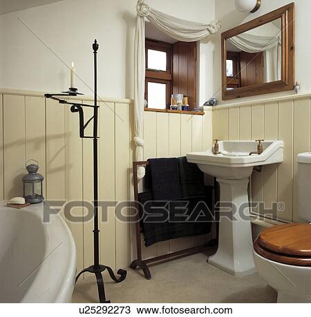 Traditional bathroom with cream painted panelling View Large Photo Image Stock Image - Traditional bathroom with cream painted panelling . Fotosearch