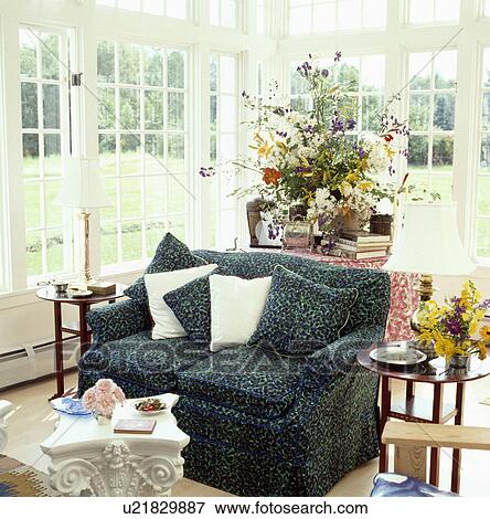 Traditional conservatory living room with comfortable furniture and green plants View Large Photo Image Stock Photo - Traditional conservatory living room with comfortable furniture and green plants. Fotosearch