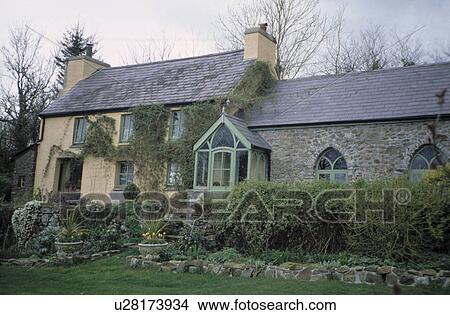 Traditional country cottage with green porch View Large Photo Image Picture - Traditional country cottage with green porch. Fotosearch