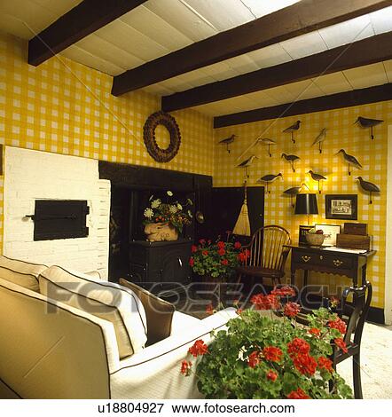 Traditional country living room with yellow+white checked fabric wall covering View Large Photo Image Stock Photo - Traditional country living room with yellow+white checked fabric wall covering. Fotosearch