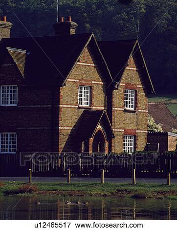 Traditional red brick Victorian house with gabled roof View Large Photo Image Stock Photo - Traditional red brick Victorian house with gabled roof. Fotosearch