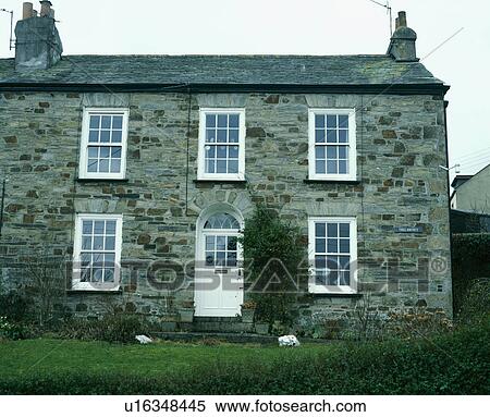 Traditional stone cottage with white windows and door View Large Photo Image Stock Photography - Traditional stone cottage with white windows and door. Fotosearch