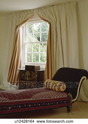 Upholstered chaiselongue in traditional living room View Large Photo Image Picture - Upholstered chaiselongue in traditional living room. Fotosearch