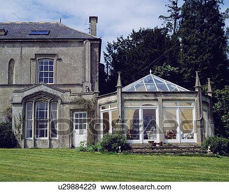 Victorian Gothic house with traditional conservatory View Large Photo Image Stock Photo - Victorian Gothic house with traditional conservatory. Fotosearch
