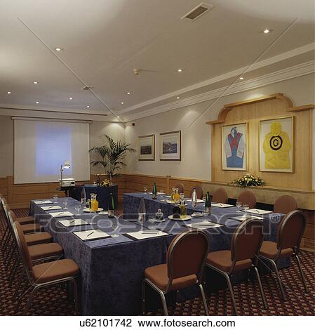 Stock Image - Well-lit modern designer decorated boardroom.. Fotosearch