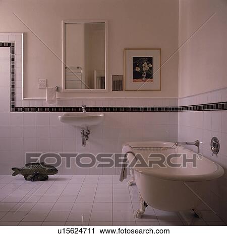 Stock Photography Of White Clawfoot Bath In Bathroom With White Clawfoot Bath In Bathroom With Tiled Wall And Black Border To Dado Height