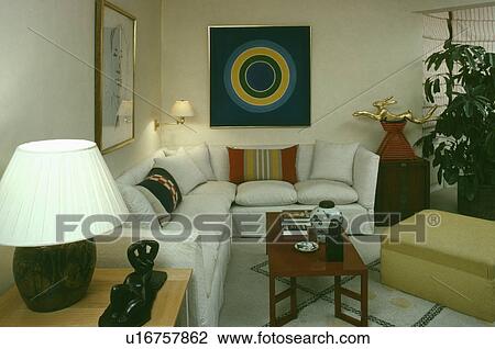White corner sofa below abstract painting in modern living room View Large Photo Image Stock Image - White corner sofa below abstract painting in modern living room. Fotosearch