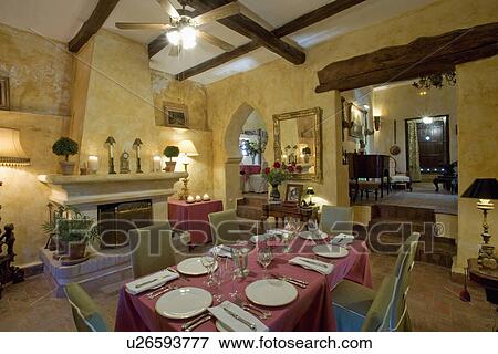 White crockery and red cloth on table in yellow dining room in Spanish villa View Large Photo Image Stock Photo - White crockery and red cloth on table in yellow dining room in Spanish villa. Fotosearch