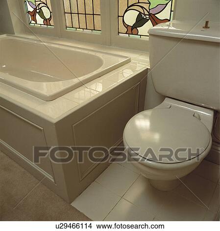 Picture - White tiled architectural bathroom.. Fotosearch