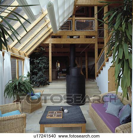 Wicker furniture in living room extension View Large Photo Image Stock Image - Wicker furniture in living room extension. Fotosearch