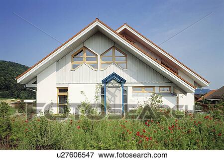 Wildflower garden in front of newbuild traditional white country house in Germany View Large Photo Image Stock Photo - Wildflower garden in front of newbuild traditional white country house in Germany. Fotosearch