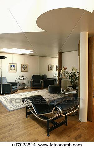 Wooden flooring in modern living room with chrome and leather Le Corbusier chaiselongue View Large Photo Image Picture - Wooden flooring in modern living room with chrome and leather Le Corbusier chaiselongue. Fotosearch