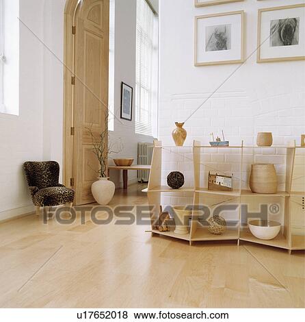 Wooden flooring in modern living room with plywood shelf unit View Large Photo Image Stock Photo - Wooden flooring in modern living room with plywood shelf unit. Fotosearch