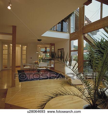 Wooden flooring in openplan modern living and dining room View Large Photo Image Stock Image - Wooden flooring in openplan modern living and dining room. Fotosearch